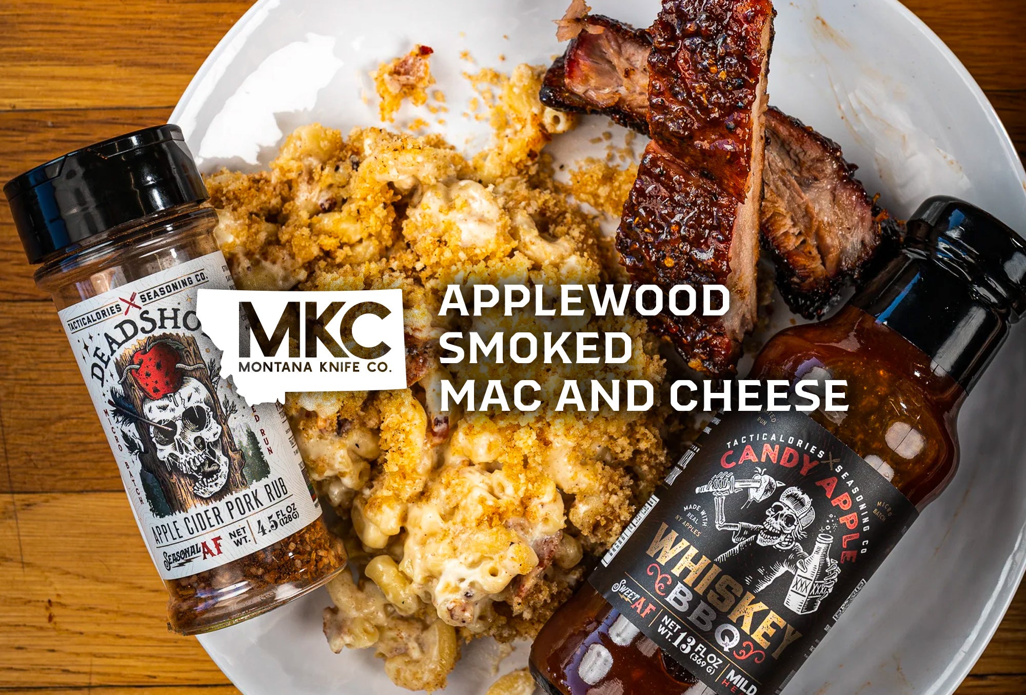 A white plate holds applewood smoked mac and cheese alongside 2 ribs and Tacticalories’ Deadshot Apple Cider Pork Rub.