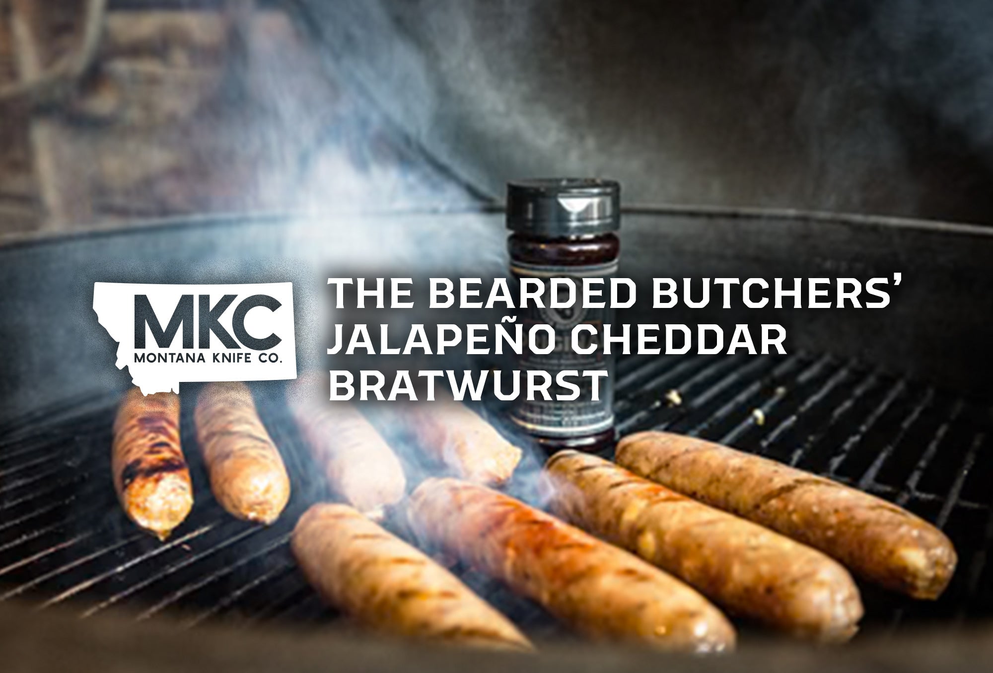 Cheddar bratwurst grilling and smoking on a grill with a Bearded Butcher Bratwurst Seasoning container.