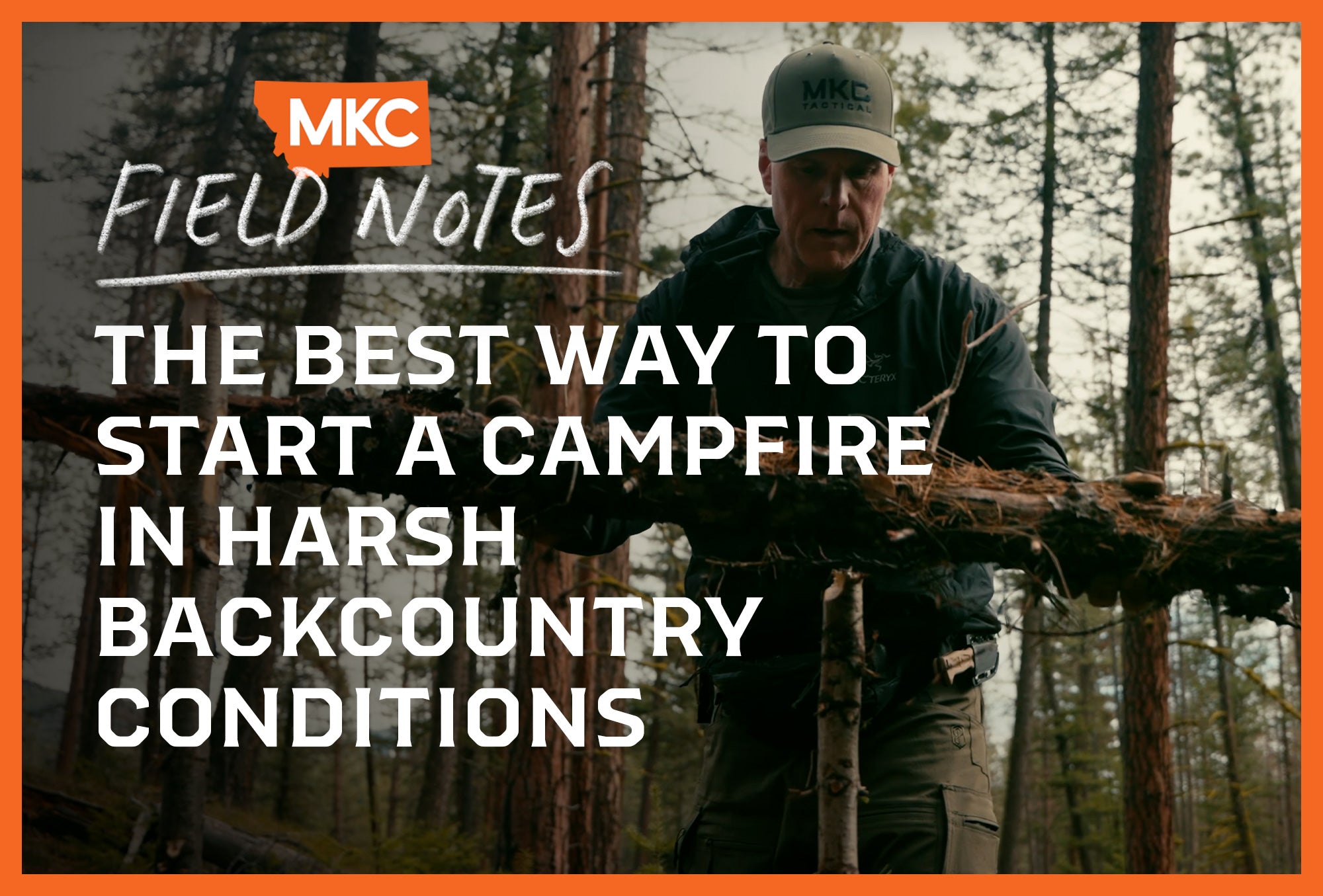 Man in an MKC hat stands in the woods preparing to build a campfire in the harsh backcountry.