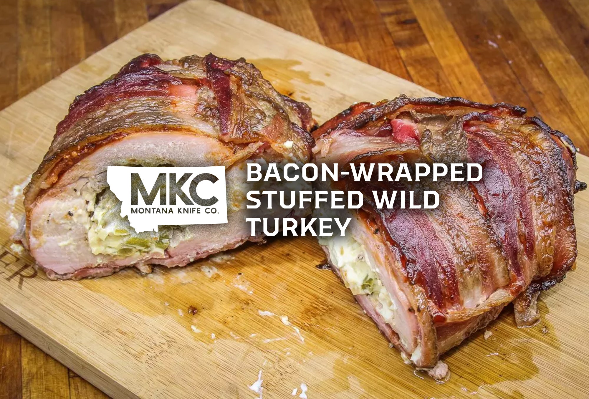 A close-up shot of the bacon-wrapped stuffed wild turkey resting on a wooden cutting board.