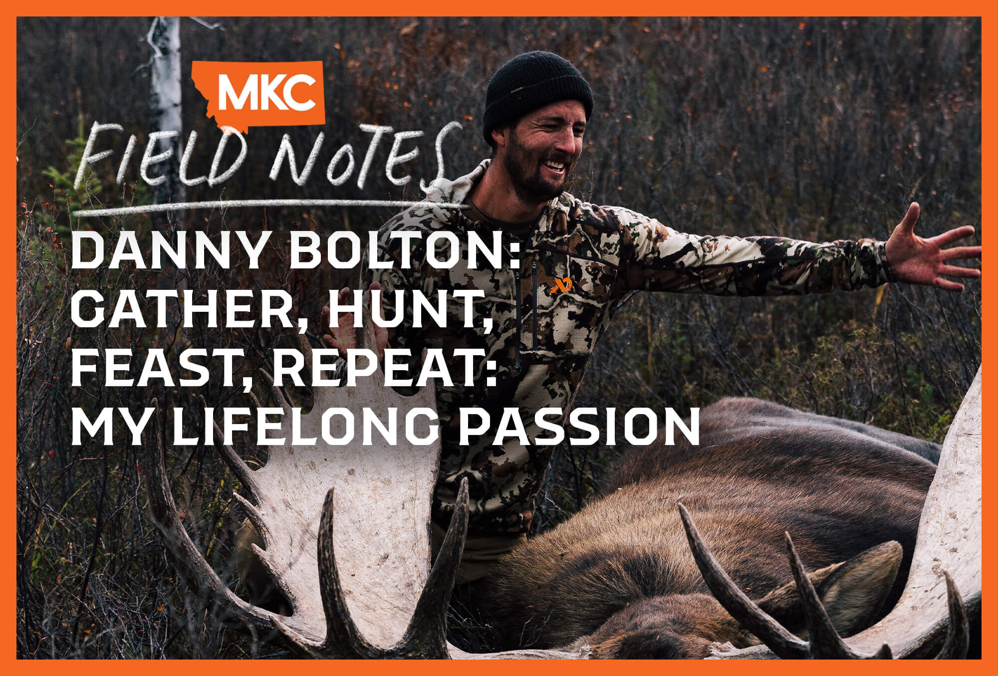 Wearing camo, Danny Bolton smiles and gestures over a downed moose in the field, representing a passion for sharing his hunt.
