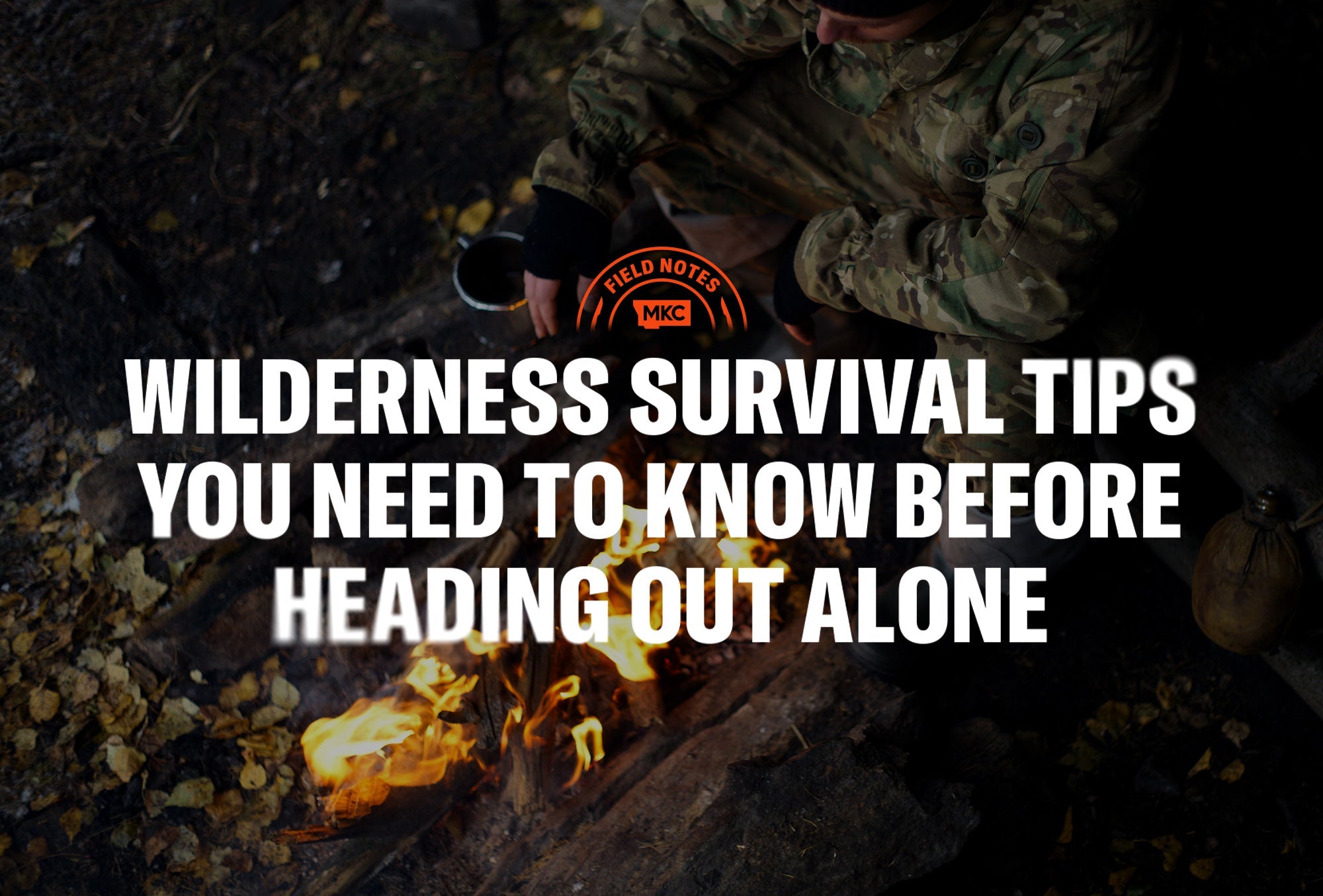 Camper by a fire holding a metal cup, illustrating wilderness survival tips for staying safe alone outdoors.