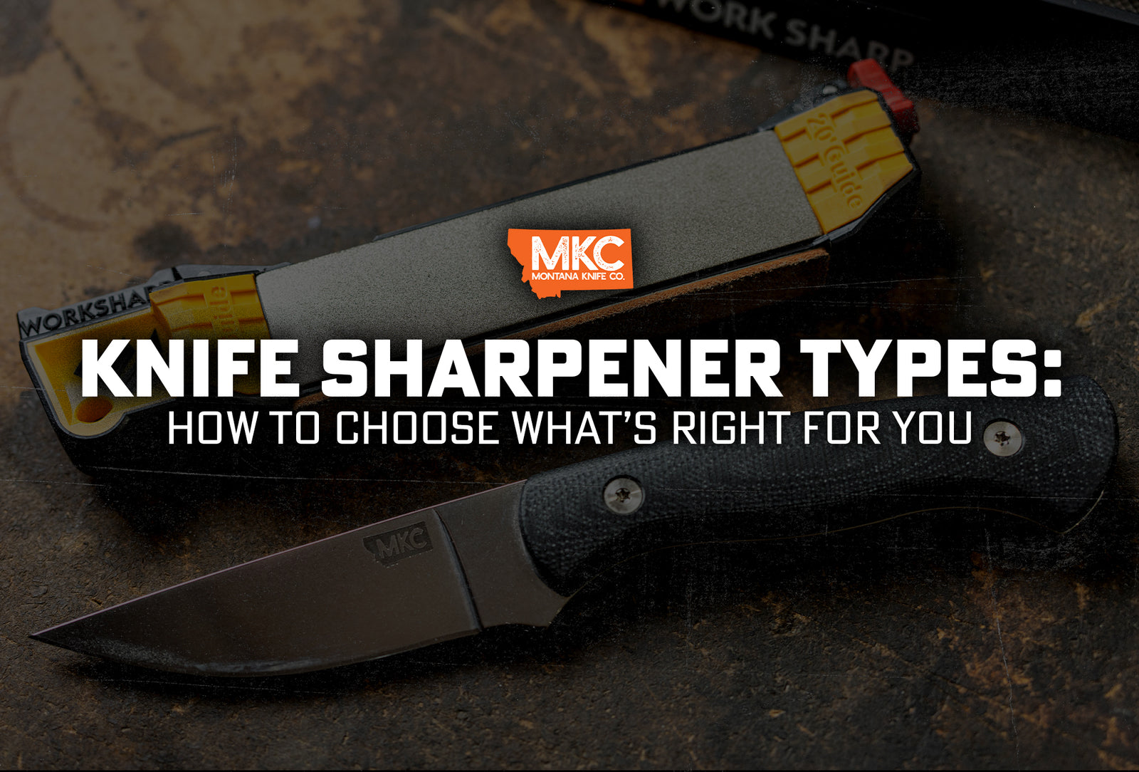 A hunting knife next to a knife sharpener on a table.