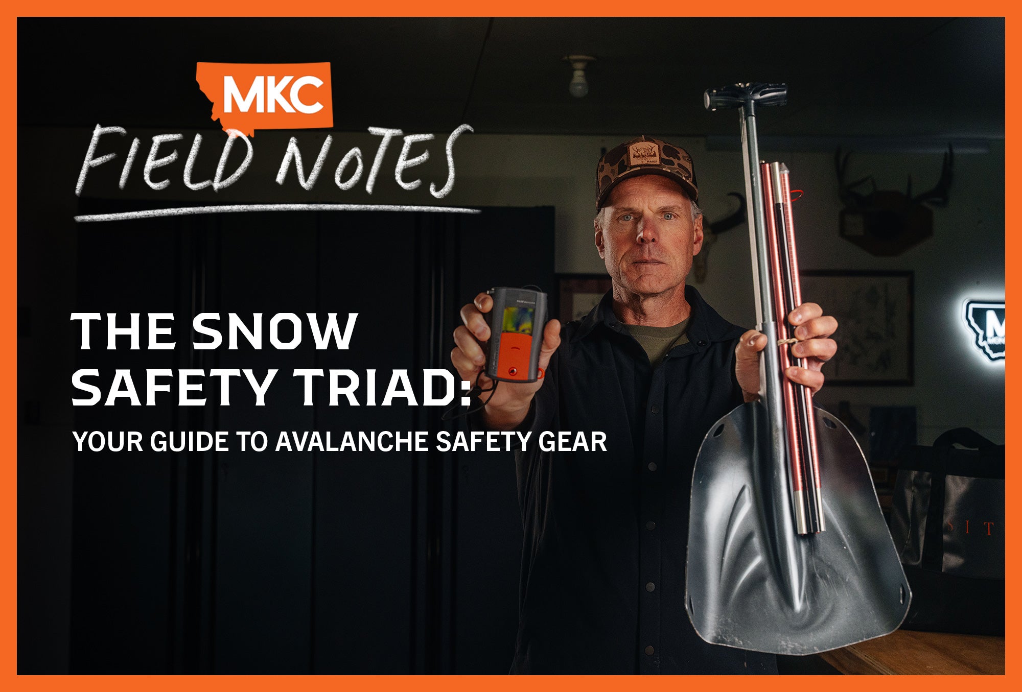 Man holding avalanche beacon and shovel.