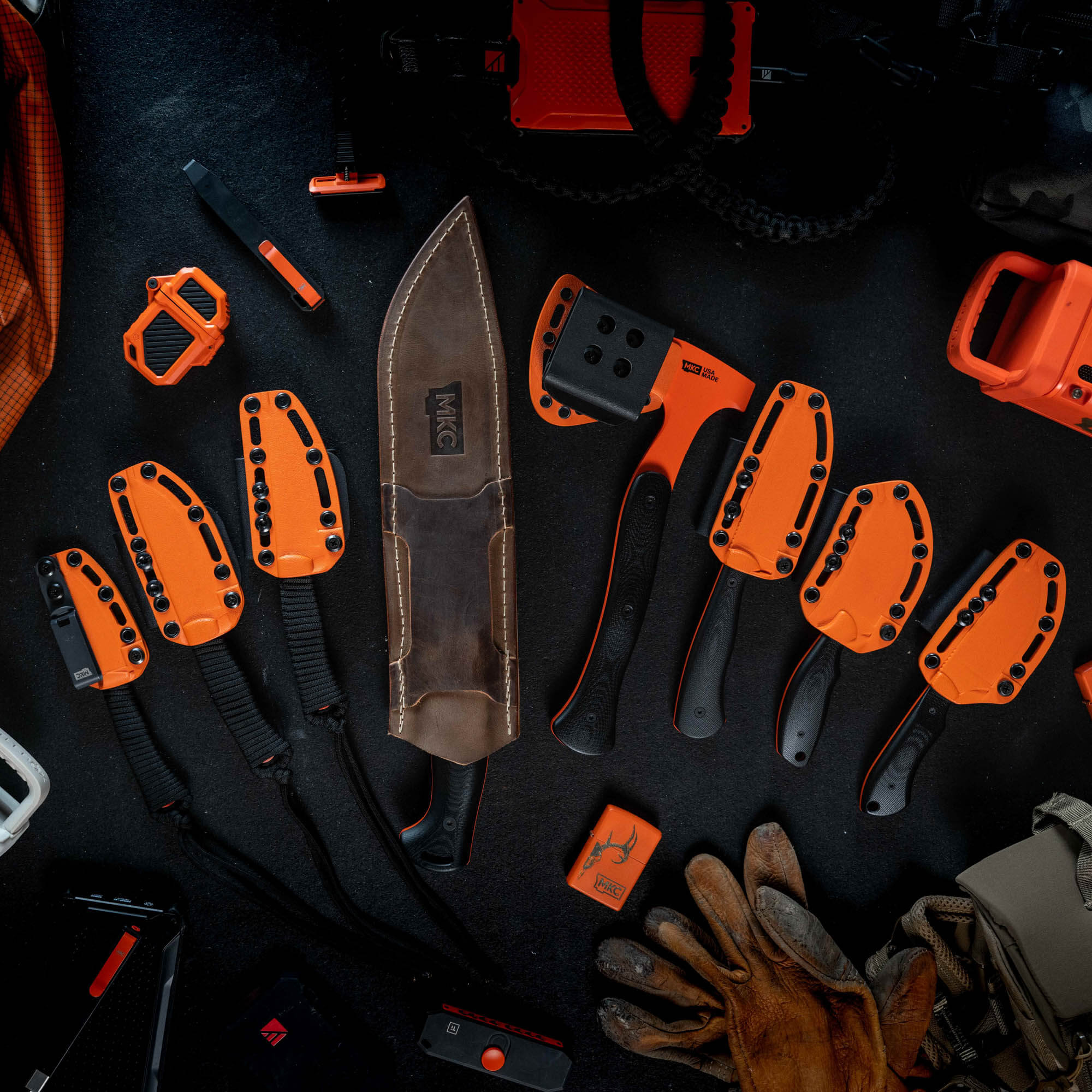 BLAZE ORANGE CERAKOTE™ knife set featuring eight durable knives and tools, ideal for outdoor and tactical use.