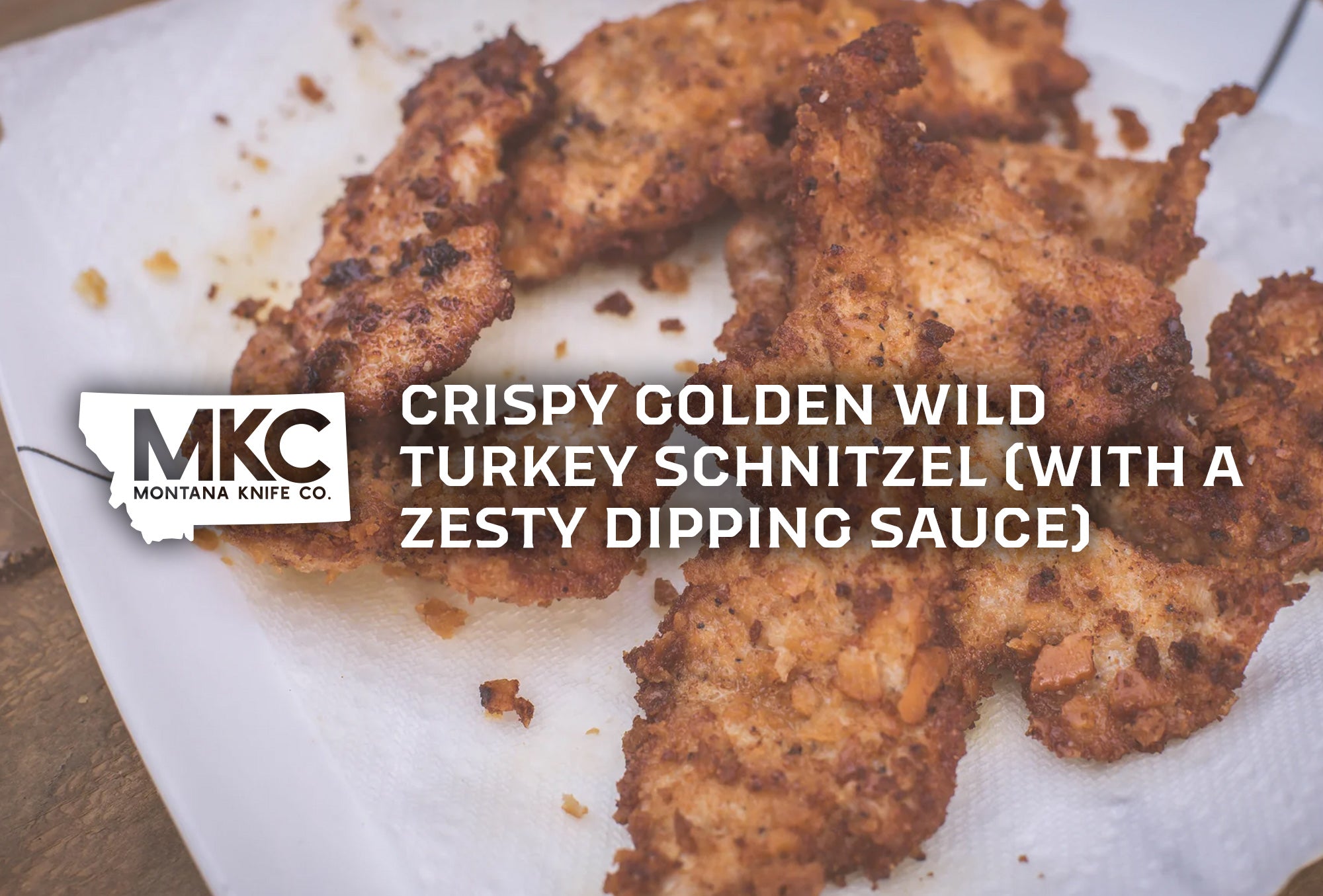 Several pieces of crispy, golden-brown breaded turkey schnitzel on a paper towel or napkin.