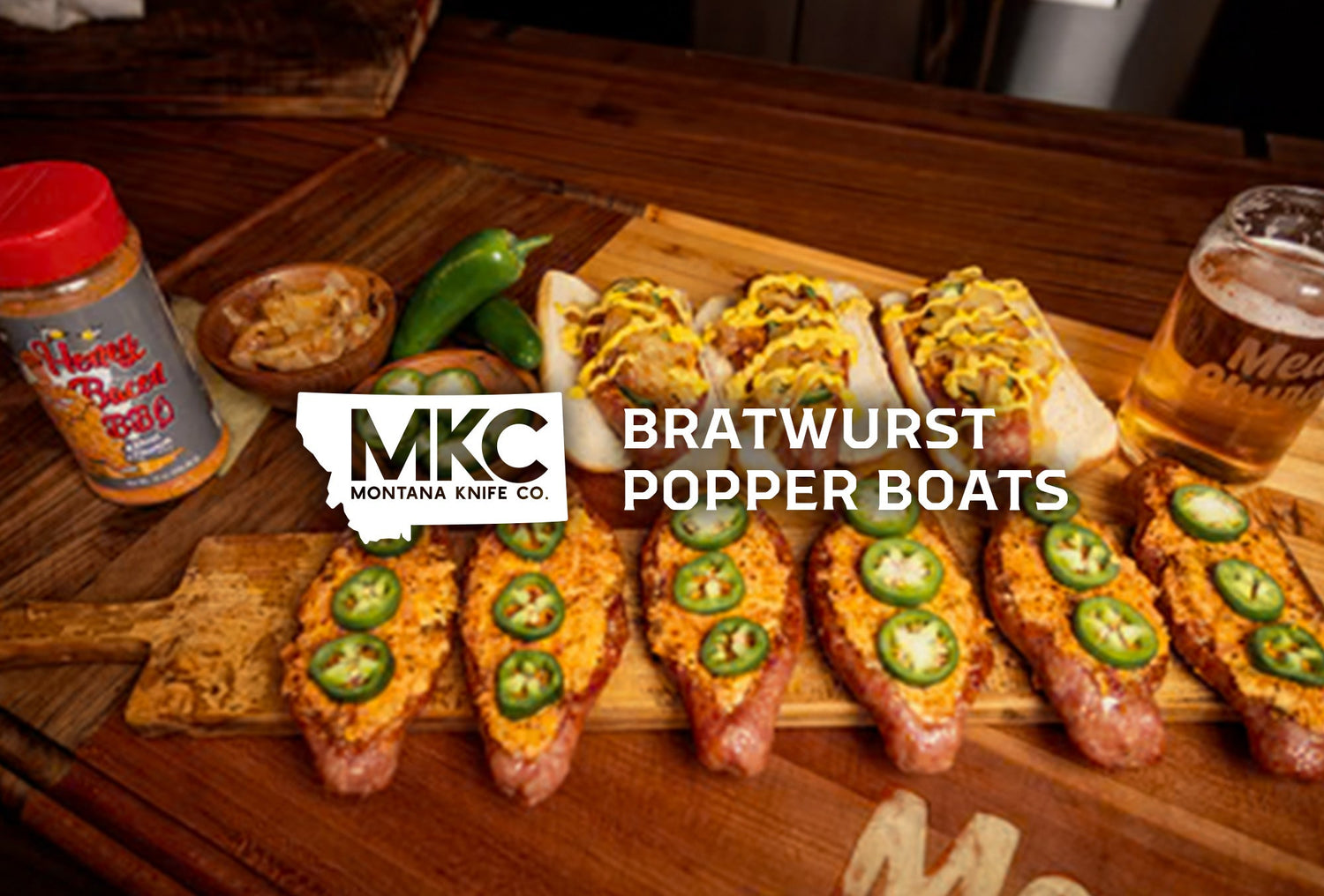 Sausage popper boats filled with creamy cheese and jalapeños smoked to golden perfection.