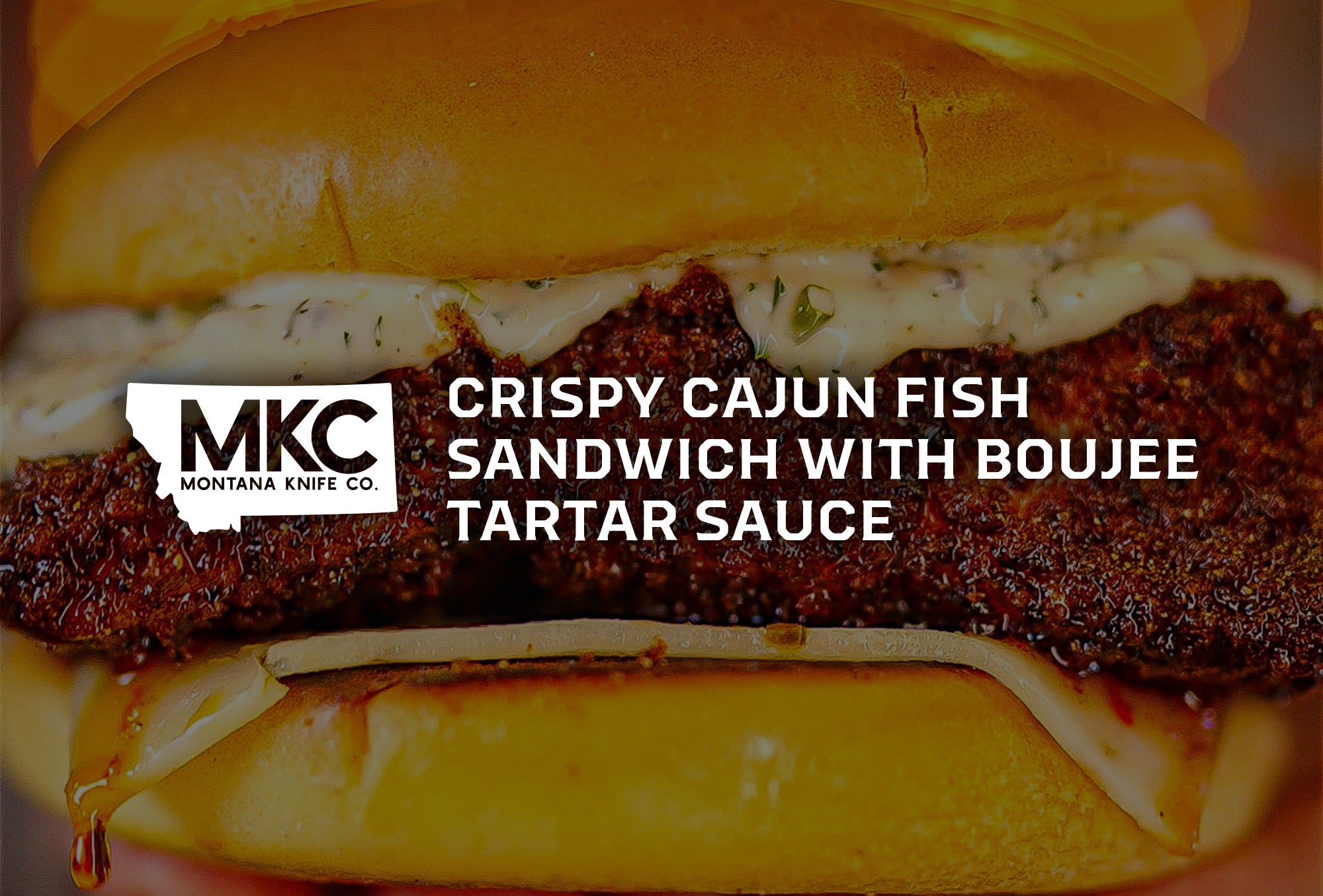 A crispy Cajun fish sandwich on a golden brioche bun.