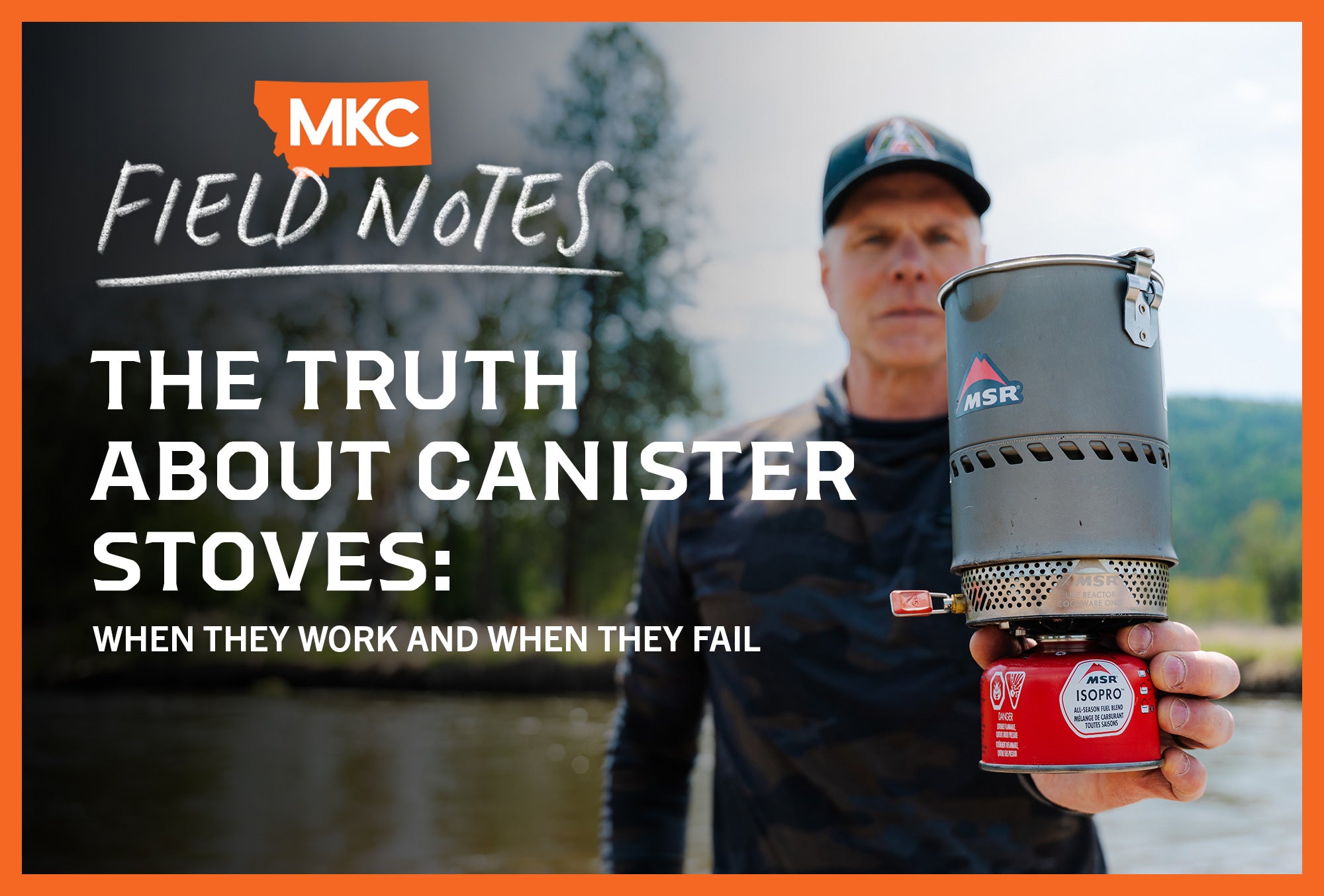 A man holding MSR canister stove outdoors.
