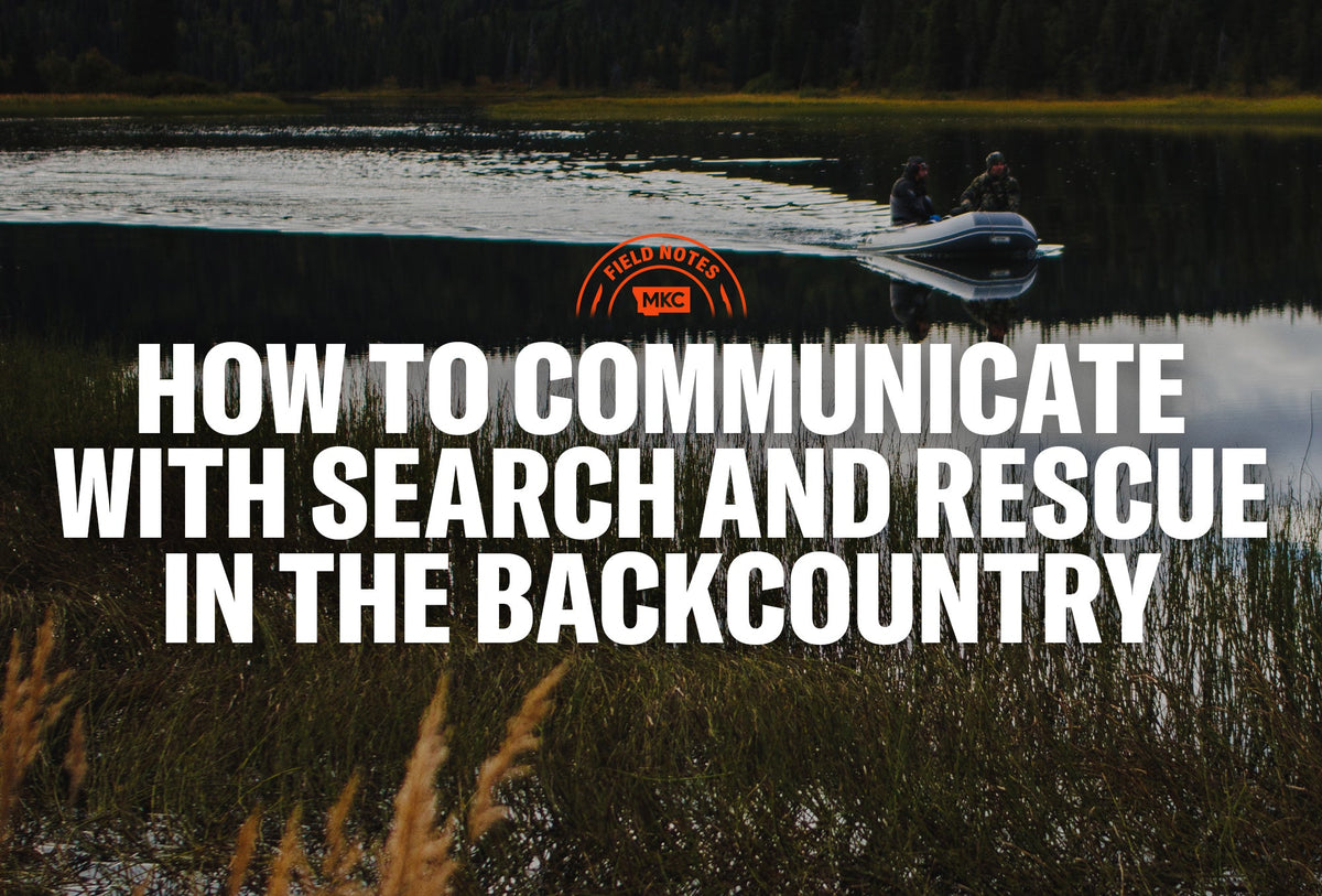 Two people in an inflatable boat on a calm forest lake with text about how to communicate with search and rescue in the backcountry.