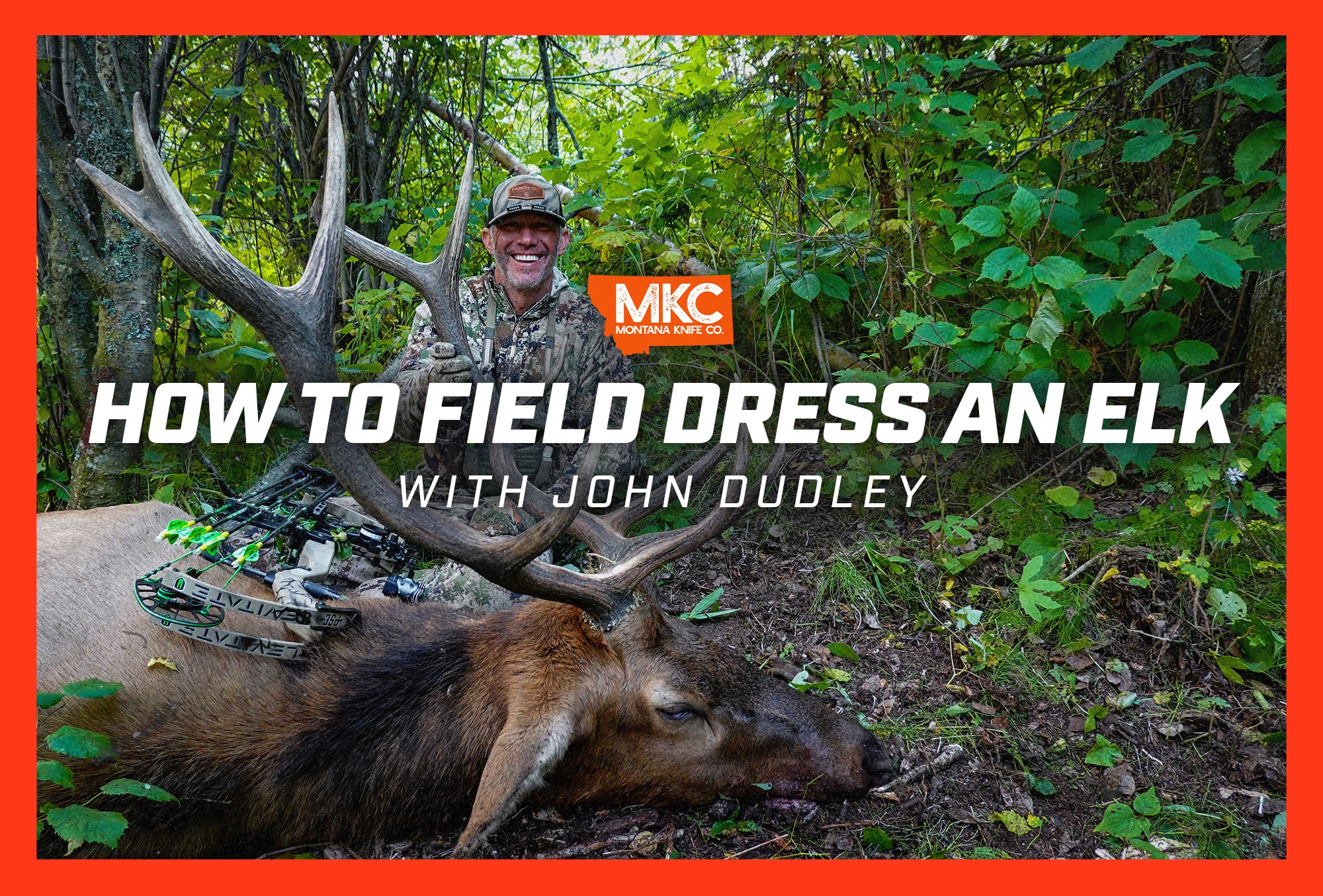 John Dudley smiles and crouches in camo behind his kill as he shares how to field dress an elk.