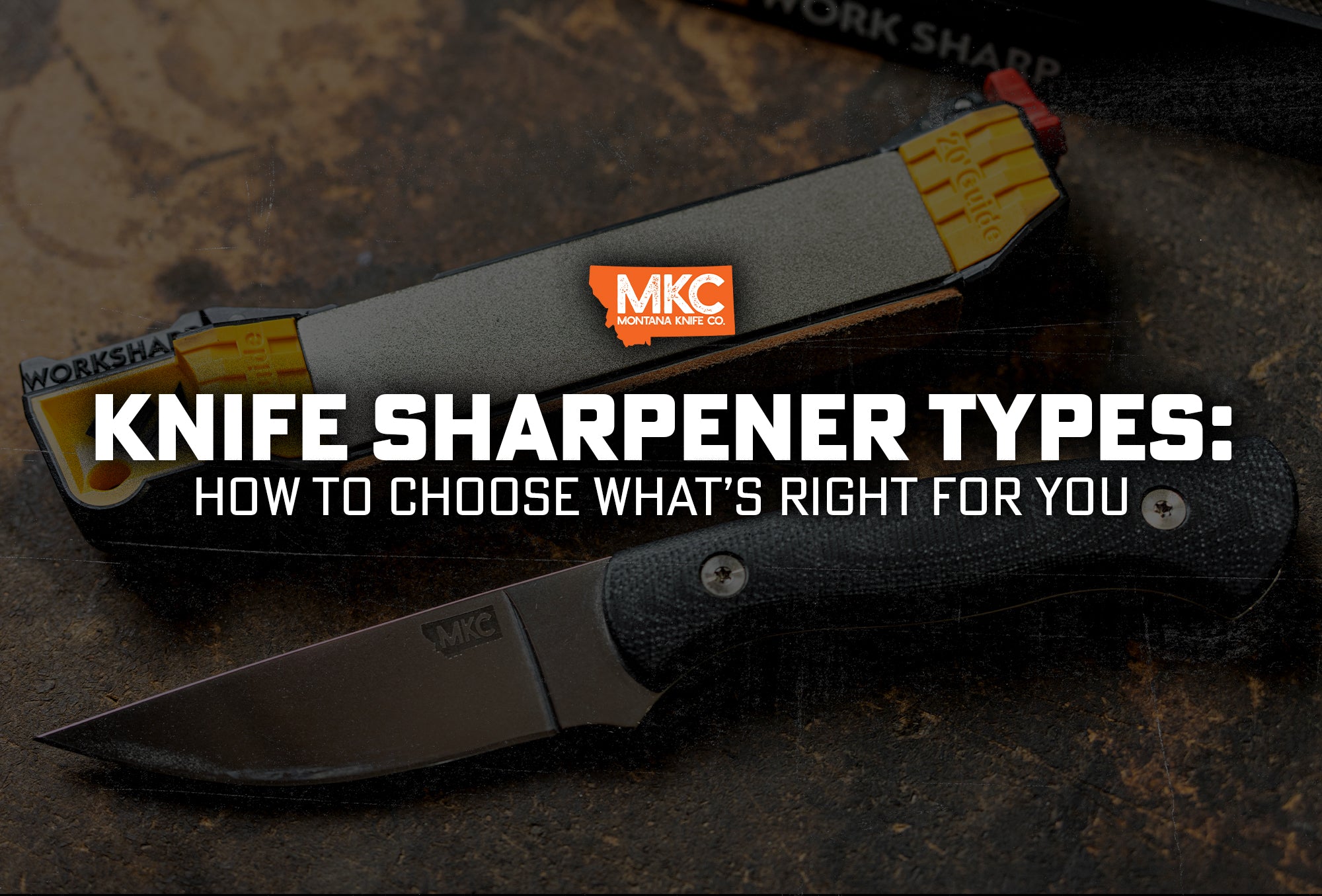 A hunting knife next to a knife sharpener on a table.