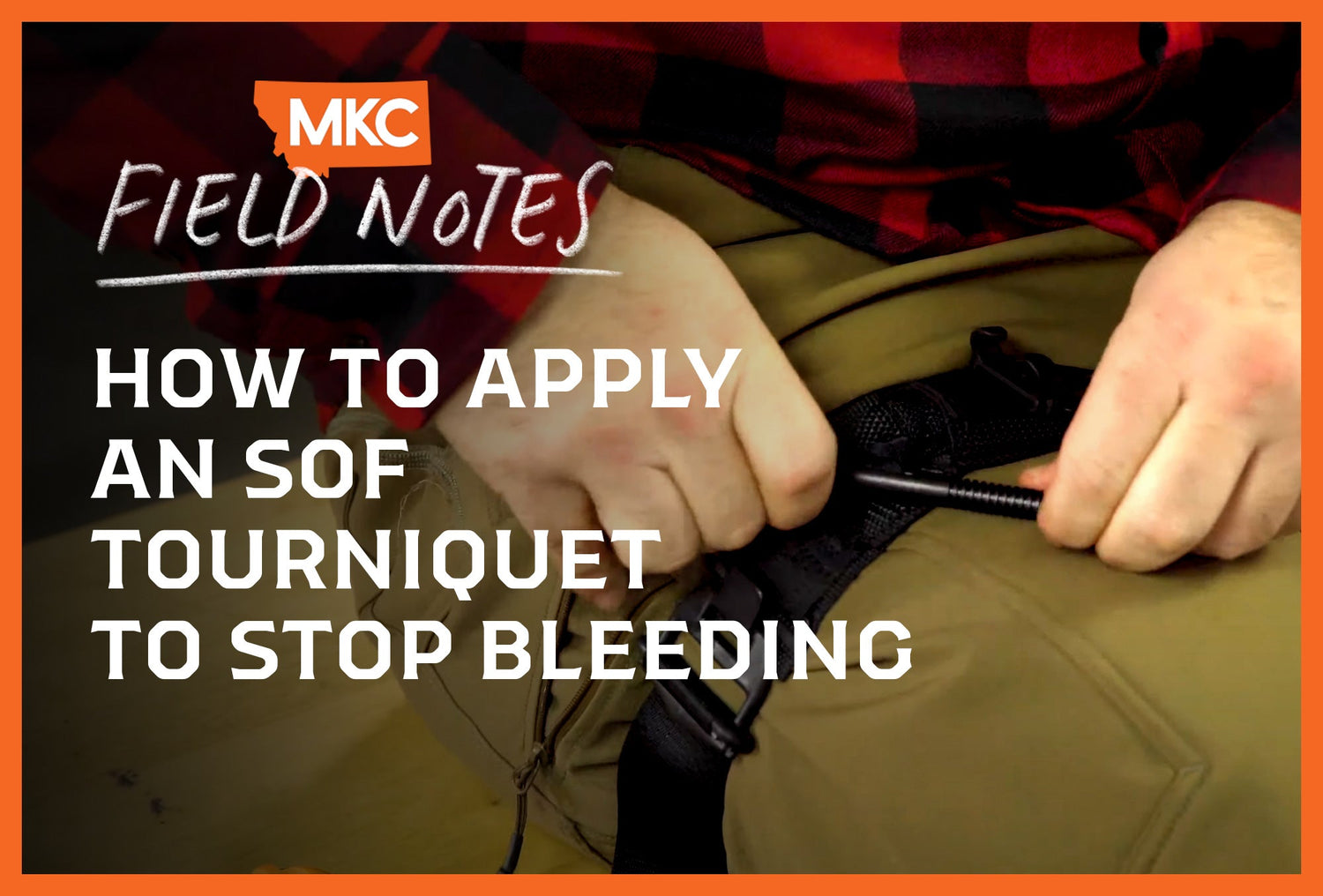 A person in a red flannel shirt demonstrating how to apply a tourniquet.