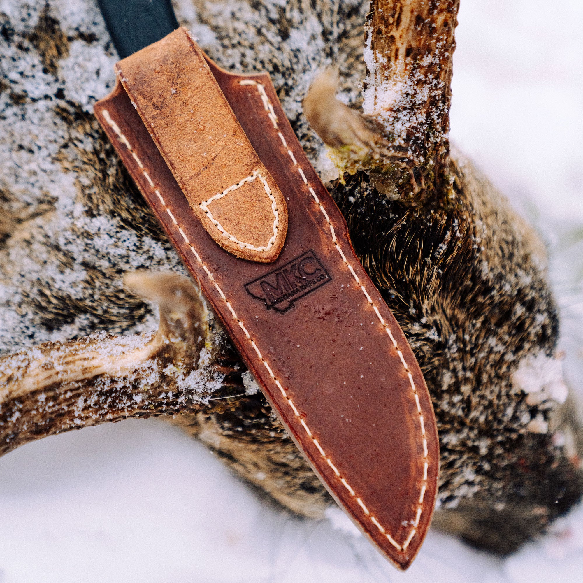 https://www.montanaknifecompany.com/cdn/shop/files/003-WHITETAIL-LEATHERSHEATH.jpg?v=1699365873&width=2000