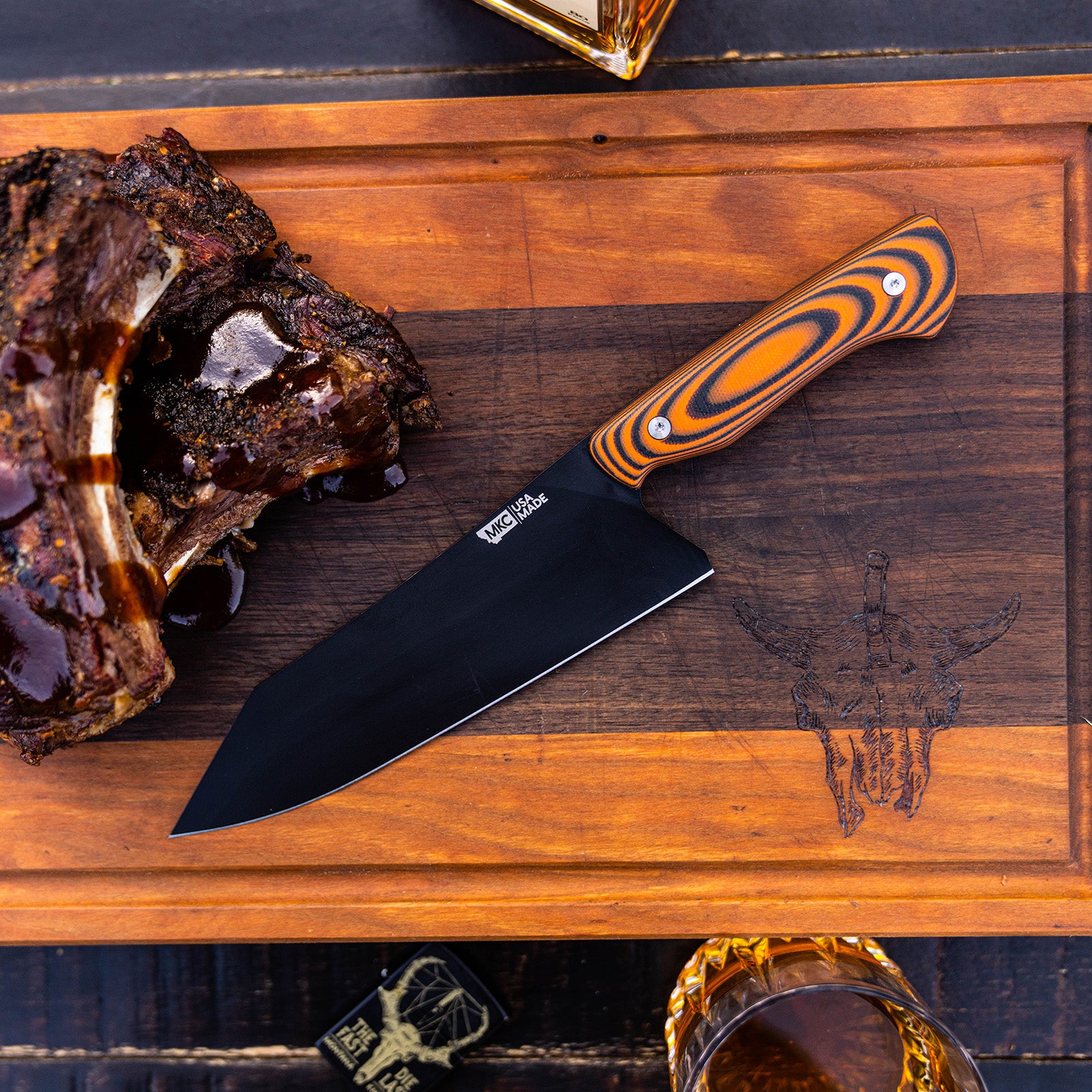 https://www.montanaknifecompany.com/cdn/shop/files/SMITH_RIVER_SANTOKU-BLACKORANGE-FEATURED-IMAGE_2.jpg?v=1694116150&width=1600